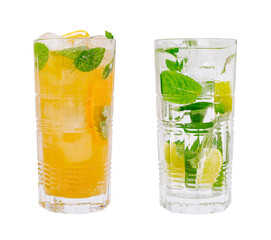 Refreshing summer beverages with mint and citrus in clear glasses