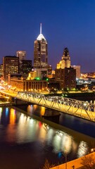 Obraz premium Night cityscape, river reflecting city lights, bridge