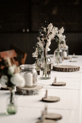 Rustic boho wedding with couple, decorations, flowers and celebration in vintage barn