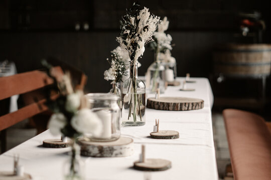 Rustic boho wedding with couple, decorations, flowers and celebration in vintage barn