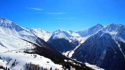 Jaufenpass, South Tyrol - Italy - Aerial view with panoramic view of snow-covered mountains