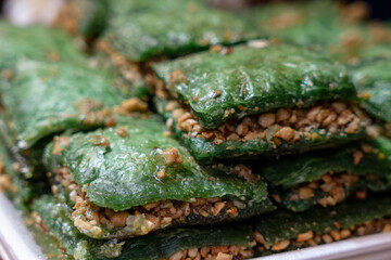 Close-up of green baklava at the festival stall