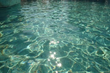 Sparkling turquoise pool water surface (1)