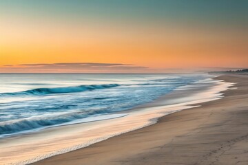 Obraz premium The golden light of dawn illuminates the tranquil beach, as gentle waves roll onto the sandy shore