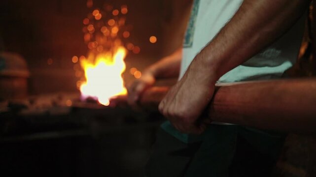 Traditional coppersmith workshop for copper brewing pots manufacturing. This handmade brewery kettles will be used for making traditional alcohol brandy drinks. Small traditional business concept.