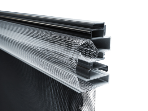 Close-up of a window or door system's sectional view, showcasing layered components and mesh.  A dark gray metal frame holds a series of overlapping profiles and transparent netting