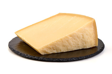 Wedge of aged Parmesan cheese on Slate Plate, isolated on white background.