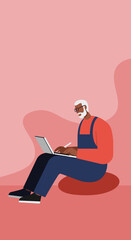 Senior African American man with glasses using a laptop and stylus while sitting casually, representing remote work and modern lifestyle.