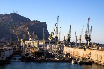 Palermo shipyard in Italy, ships in storage and cranes in the shipyard