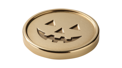 Golden coin with carved jack o lantern face for Halloween celebration