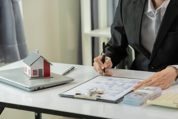 Buying, selling, renting real estate for profit, investing in real estate for a successful future, tax benefits for buying real estate, close-up image.