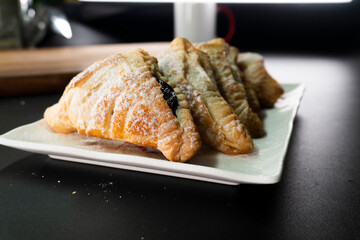 Puff pastry triangles with jam. Dessert. Pastry. Dough