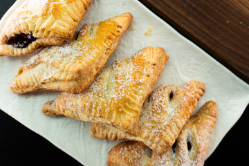 Puff pastry triangles with jam. Dessert. Pastry. Dough