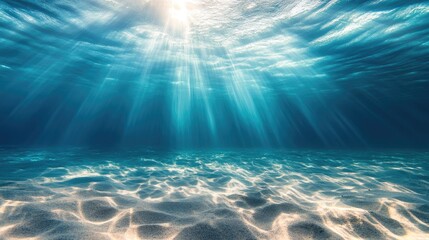 Sunlight streams through underwater, sandy bottom (1)