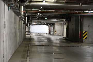 Exit from a bunker, concrete tunnel with water and ventilation installations
