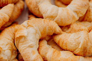 fresh croissant on wooden table, croissants on a wooden table