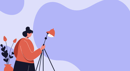 Woman setting up a studio light, representing creativity, design, or a home workspace. Ideal for concepts of inspiration, artistic endeavors, and modern work.