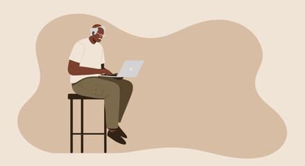 Engaged senior Black man confidently uses a laptop, representing digital literacy, remote work, and modern independent lifestyle.