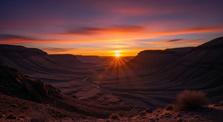 Fototapeta premium Scenic Sunset Over Rugged Canyon Landscape with Vibrant Sky and Dramatic Clouds