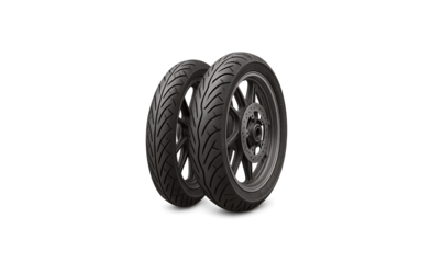 Pair of modern black scooter tires with detailed tread patterns isolated on a clean white surface ready for automotive advertising and design. transparent background