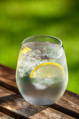 glass of water with ice and lemon