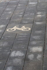 Bicycle symbol on textured pavement surface