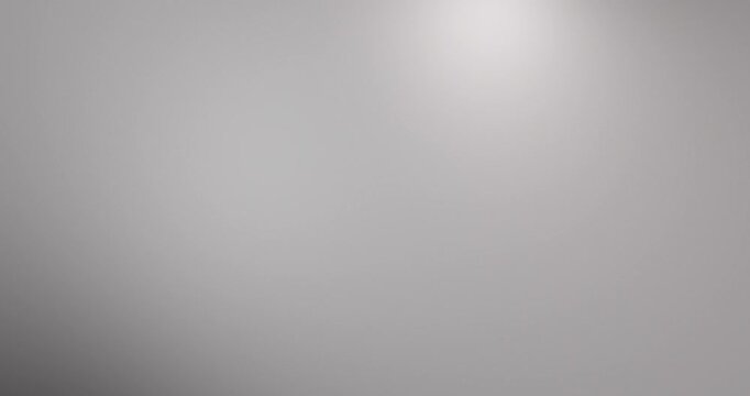 4K Abstract blurred white gray gradient background video. Smooth silver and charcoal color blend with soft fade and subtle glow effect. Minimal modern backdrop loop for motion graphics, presentations