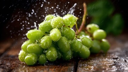 This image features a cluster of fresh green grapes glistening with water droplets on a rustic wooden table, evoking freshness and natural beauty in a serene setting.
