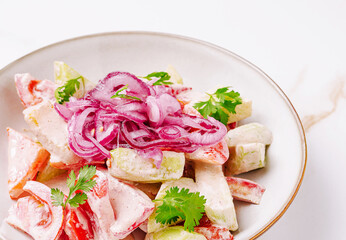 Fresh vegetable salad with creamy dressing and vibrant garnishes