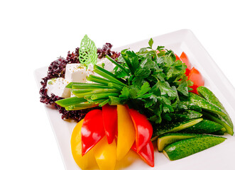 Fresh vegetable platter with herbs and cheese garnishing