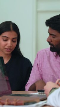 Young couple receiving devastating medical news, holding each other closely with deep emotional support and vulnerability while facing challenging health diagnosis in clinical setting