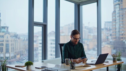 Wealthy ceo writing copybook creating business startup at light office interior