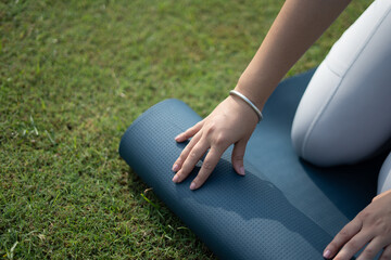 Indian woman practicing yoga in park