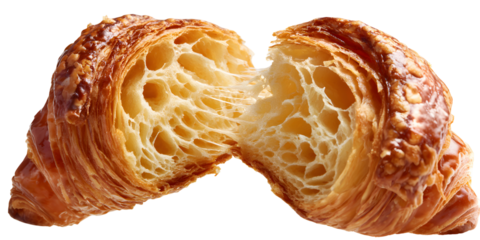 A halved croissant reveals its airy, honeycomb interior and flaky layers. Golden-brown and buttery, a perfect example of a classic French pastry.