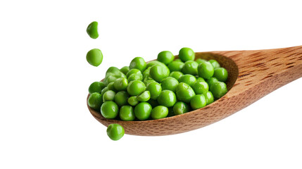 Green peas falling from wooden spoon on clean white background