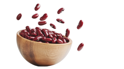 Kidney beans falling from wooden bowl on clean white background