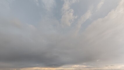 Obraz premium Cloudy sky with soft sunlight and dramatic atmosphere. Perfect for weather, climate, nature, environment, and background design. Ideal for websites, blogs, presentations, educational projects, and adv