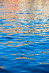 Abstract background created with a closeup of the waves of a water canal