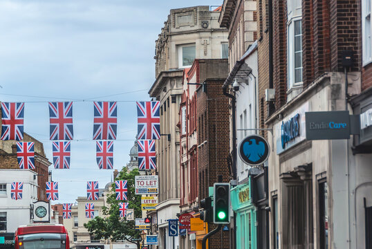 Richmond with Union flags hanging between buildings. Barclays bank. Richmond high street.