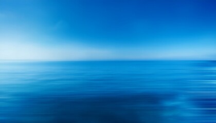 Obraz premium a blurry blue background the sky and water with a gradient that transitions from light blue to dark blue