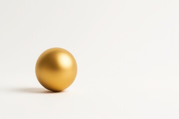 Golden decorative sphere on clean white background with soft shadow positioned left empty bright space on right for text premium minimal elegant concept for advertising and marketing
