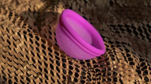 Silicone menstrual disc transitions through various angles on textured natural surface for intimate hygiene. Silicone menstrual disc, reusable intimate hygiene . Menstruation concept