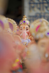 Lord Ganesha idol for Ganesh Chaturthi festival in India, Colorful Ganpati statue Stock Photo, Lord...