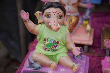 Lord Ganesha idol for Ganesh Chaturthi festival in India, Colorful Ganpati statue Stock Photo, Lord...