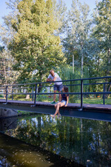 Father and daughter in the park on a summer morning spending time together enjoying nature.