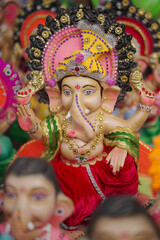 Lord Ganesha idol for Ganesh Chaturthi festival in India, Colorful Ganpati statue Stock Photo, Lord...