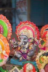 Lord Ganesha idol for Ganesh Chaturthi festival in India, Colorful Ganpati statue Stock Photo, Lord Ganesha murti. 
