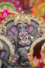 Lord Ganesha idol for Ganesh Chaturthi festival in India, Colorful Ganpati statue Stock Photo, Lord...