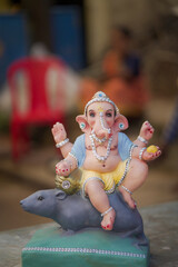 Lord Ganesha idol for Ganesh Chaturthi festival in India, Colorful Ganpati statue Stock Photo, Lord...