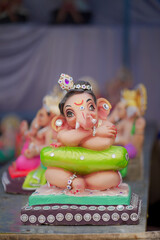 Lord Ganesha idol for Ganesh Chaturthi festival in India, Colorful Ganpati statue Stock Photo, Lord...